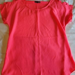 Hot pink top with cut out sleeves. Size Small
